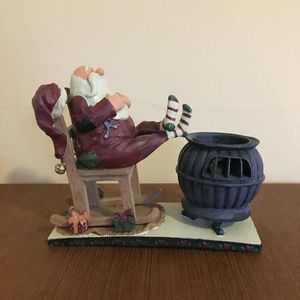 Small Relaxing Santa Figure by Rocking Chair and C